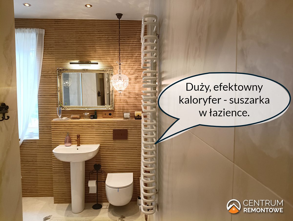 Wyremontowana łazienka z dużym białym grzejnikiem pełniącym także rolę suszarki.